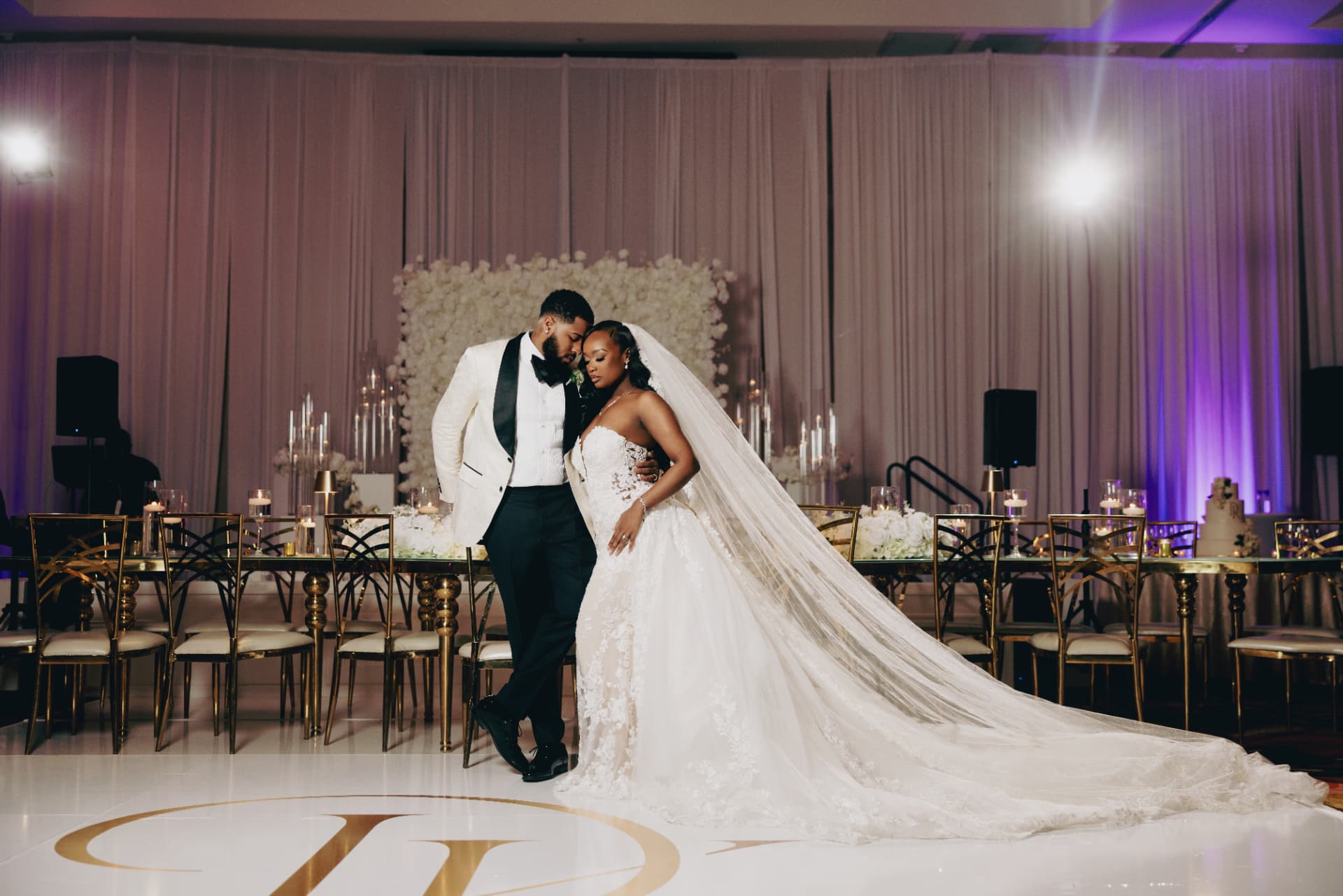 Bride and groom sharing a quiet moment on the reception dance floor